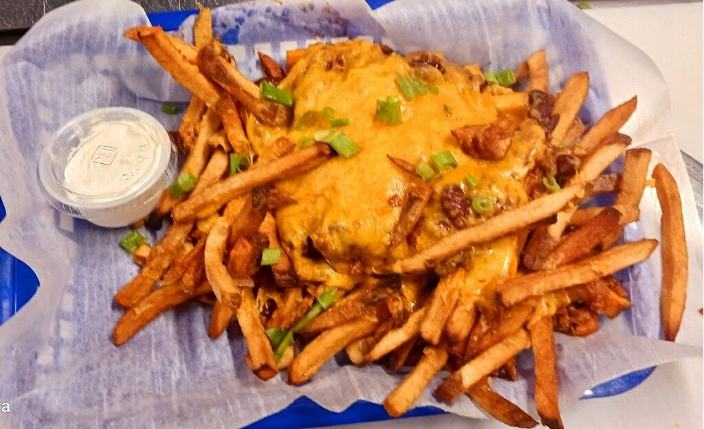 Basket of chili cheese fries loaded with chives