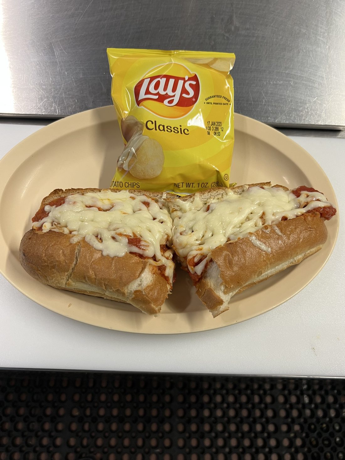 Meatball parm sub smothered in melted mozzarella