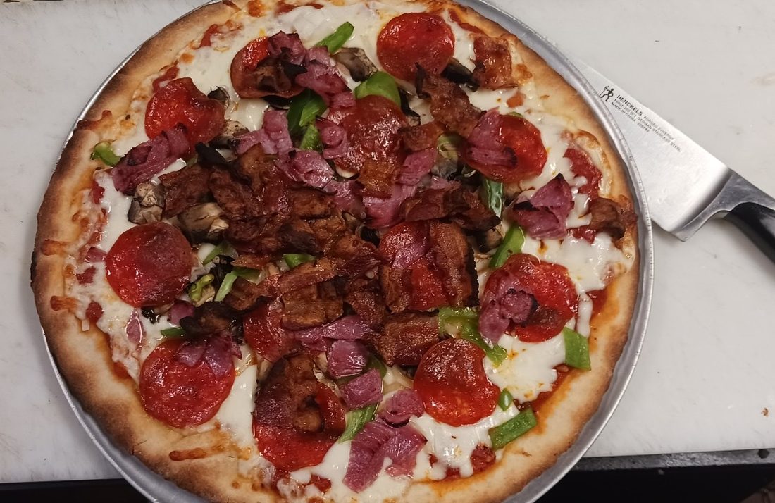 Loaded supreme bar pizza at Kelly's Keywest